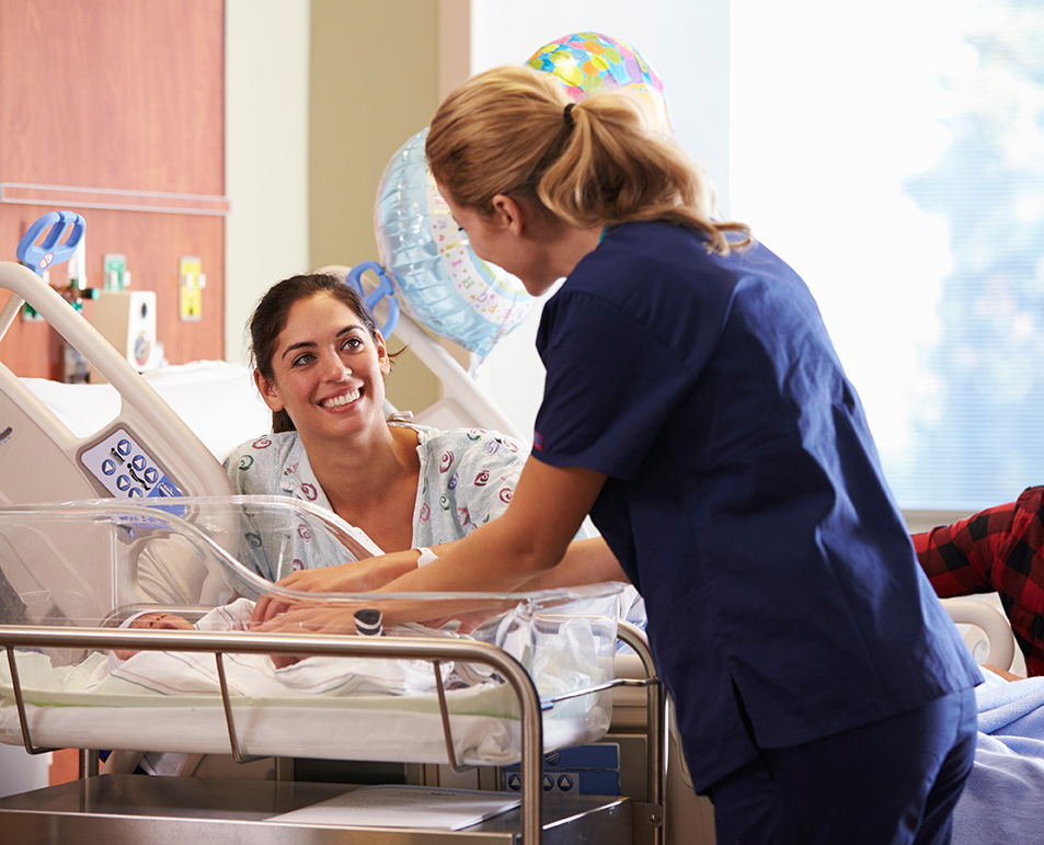 nurse with mother and baby
